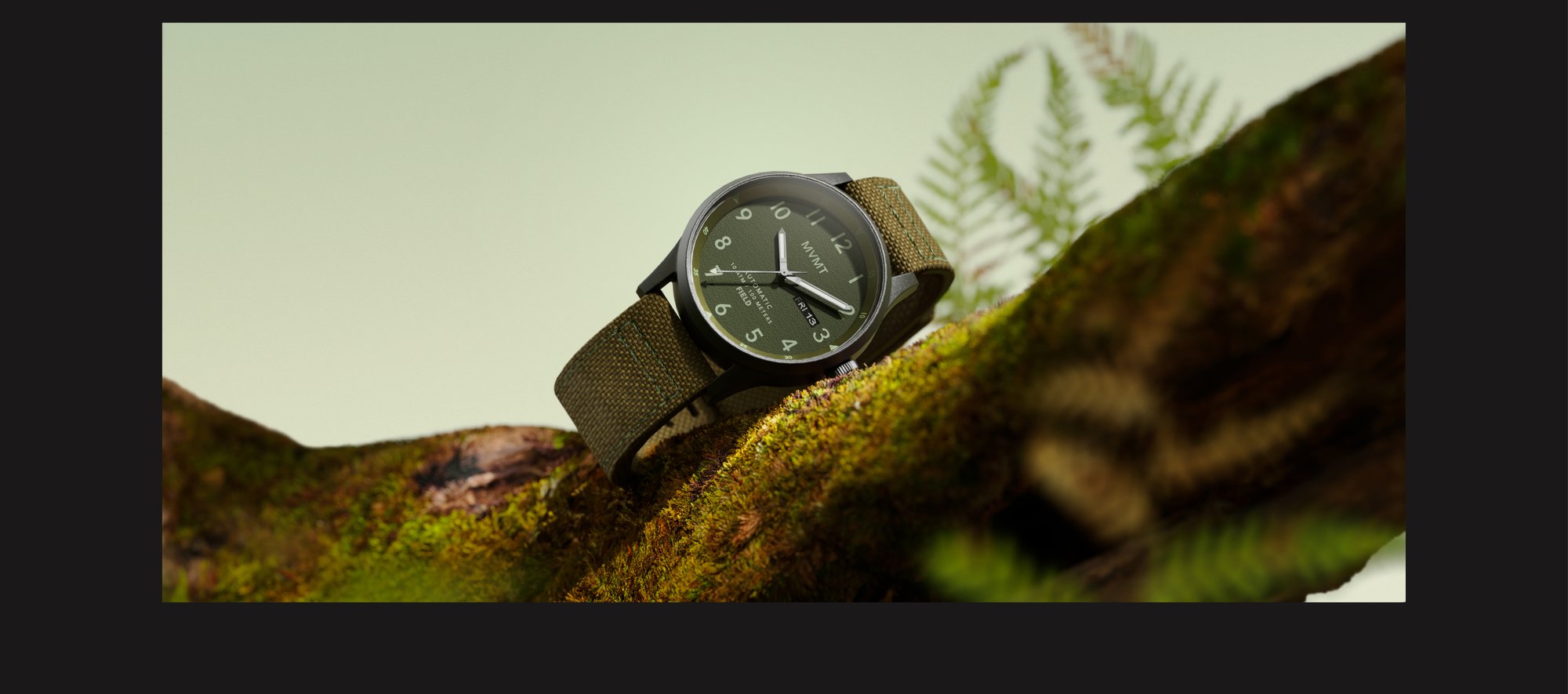 MVMT field watch w green strap on moss