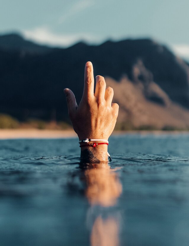 Hand coming out of water