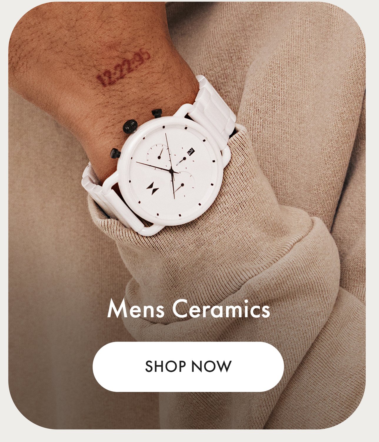 MVMT men's white ceramic watch on wrist