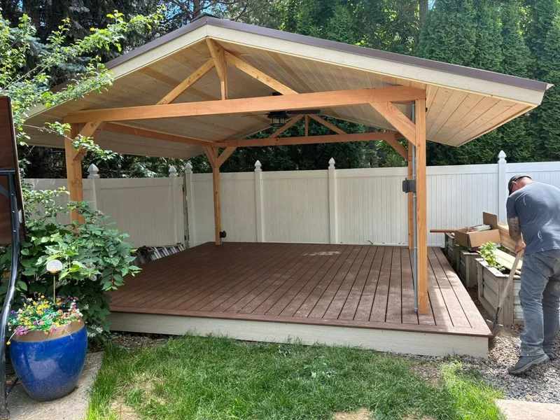 Covered wood deck and gazebo structure in a backyard