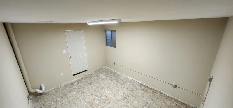 Finished basement room ready for painting and wall finishing