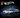 A set of three cars on a dark background. Logos overlaid include Mattel Brick Shop and Hot Wheels.