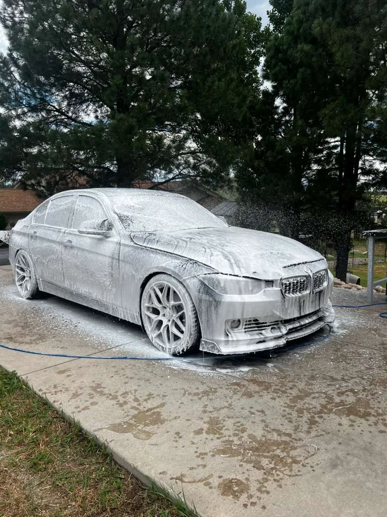 Vehicle covered in thick foam during wash