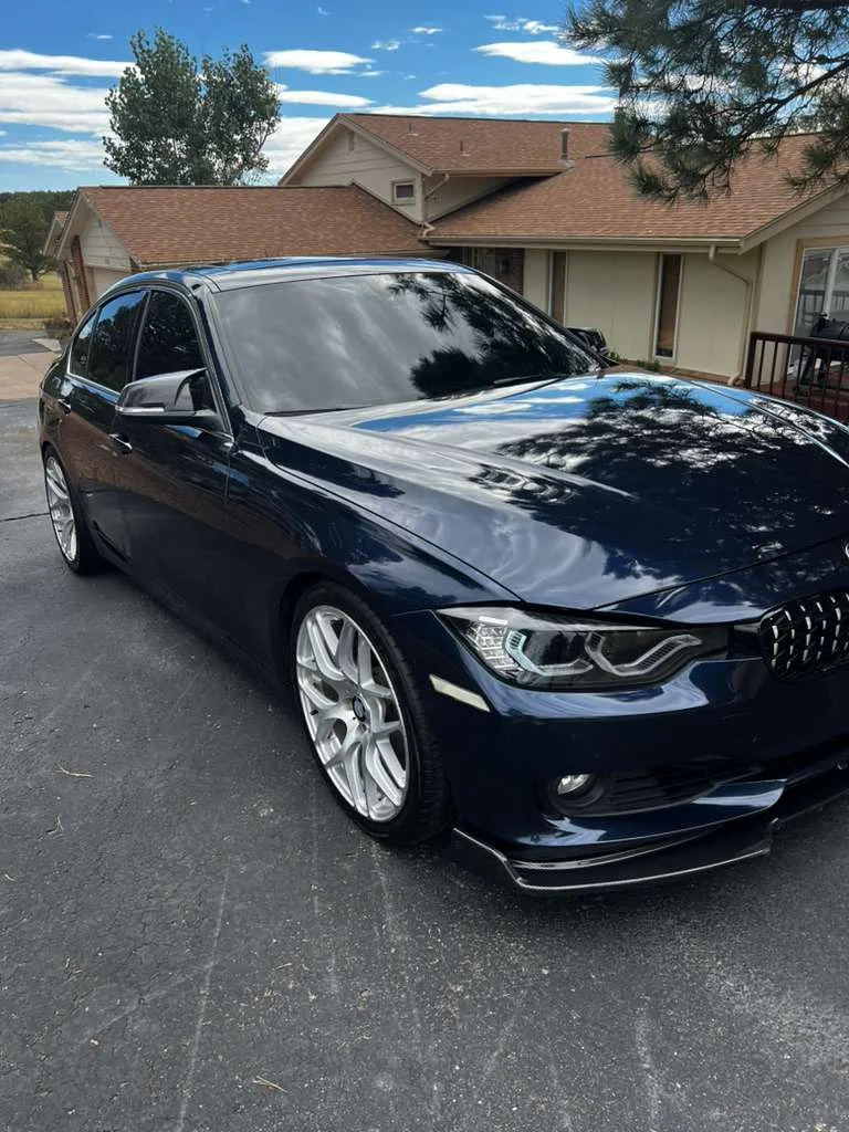 Detailed sedan with reflective finish parked in driveway