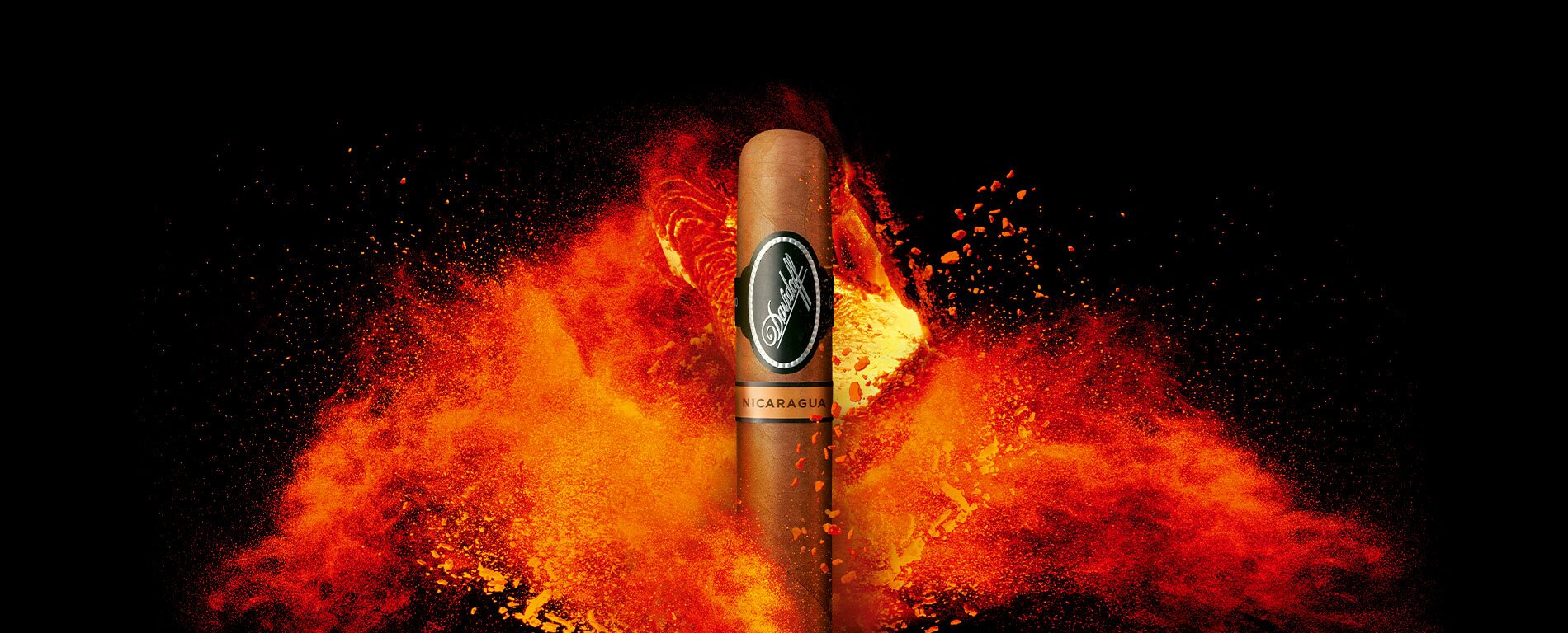 A Davidoff Nicaragua cigar standing in front of a powerful bright orange fire.