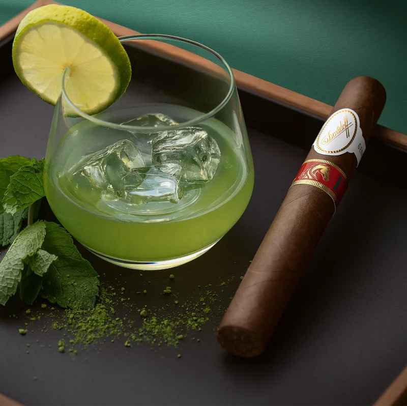 Matcha lemonade with the Year of the Horse cigar next to it.