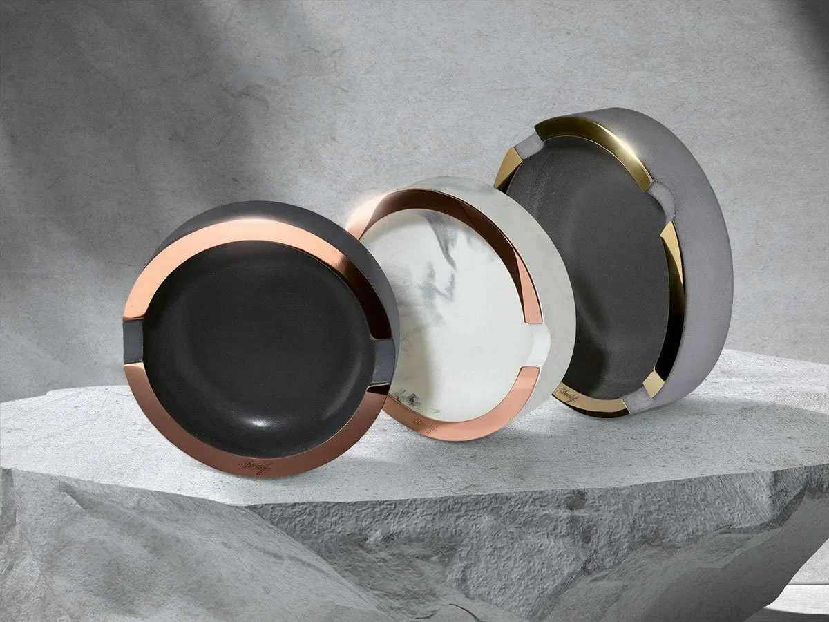 Davidoff Concrete Ashtrays in 2 different sizes and three different material colors - dark grey concrete, white marble and grey with a golden border