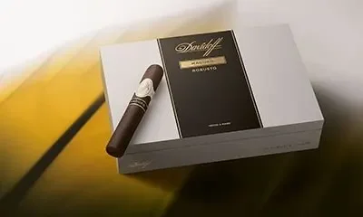 Davidoff Maduro cigar box with a cigar on top