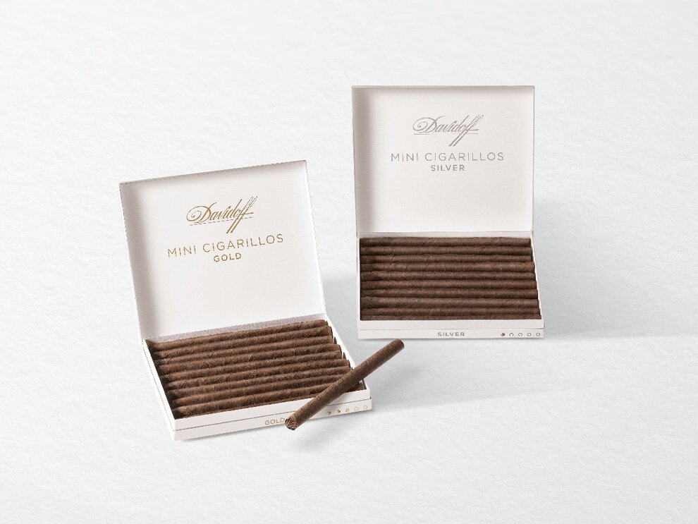 An opened box of Davidoff Mini Cigarillos Silver next to an opened box of Davidoff Mini Cigarillos Gold.