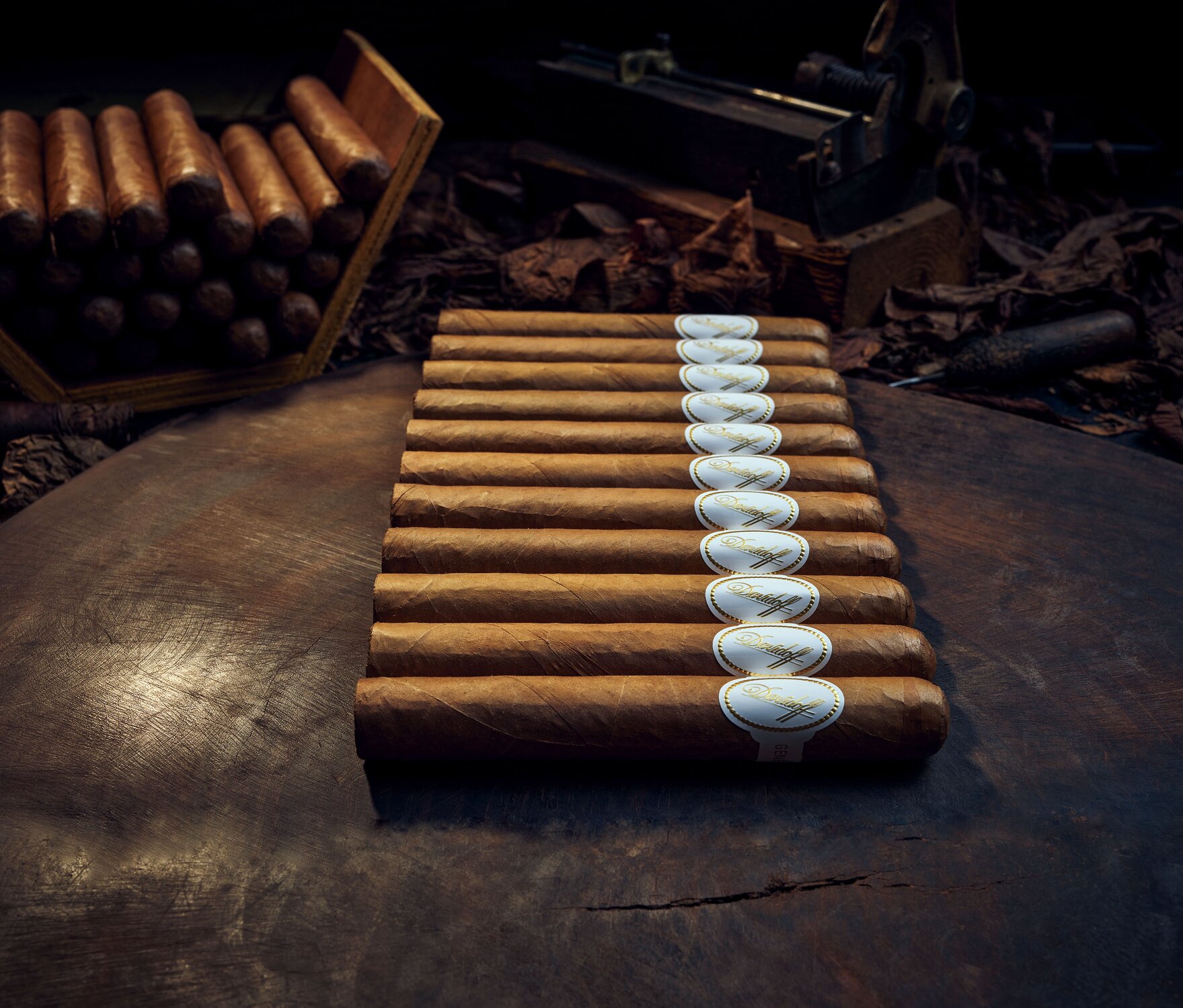 Davidoff White Band cigars on the wooden base on which cigars are rolled