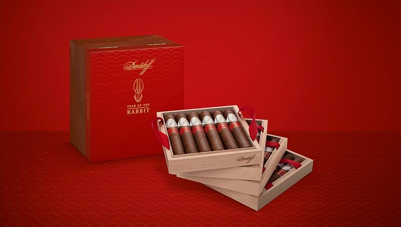 4 Trays of the Davidoff Year of the Rabbit Flagship Exclusive with cigars inside, placed next to their box.