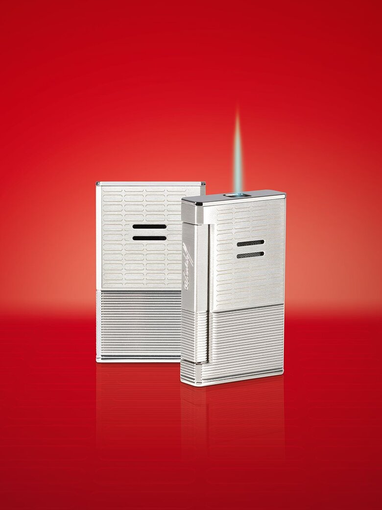 The Davidoff Year of the Ox Limited Edition Jet Flame lighter in silver on a red background. 