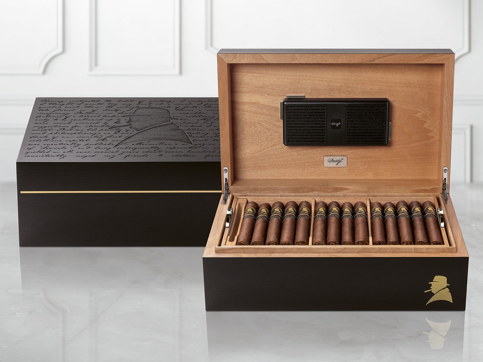 Opened Davidoff Winston Churchill Ambassador Humidor with «The Late Hour Series» cigars inside next to another closed humidor.