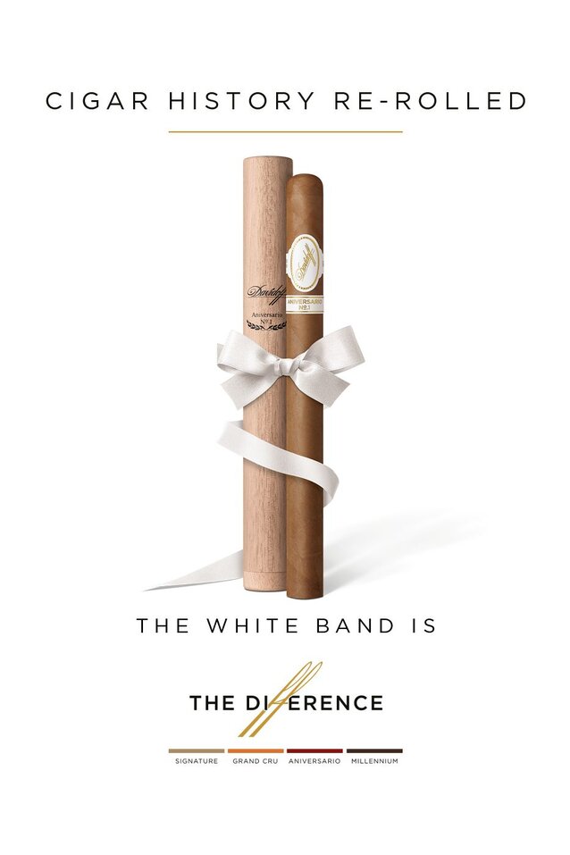 A Davidoff Aniversario No.1 Limited Edition Collection placed next to its wooden tubo wrapped with a white ribbon.