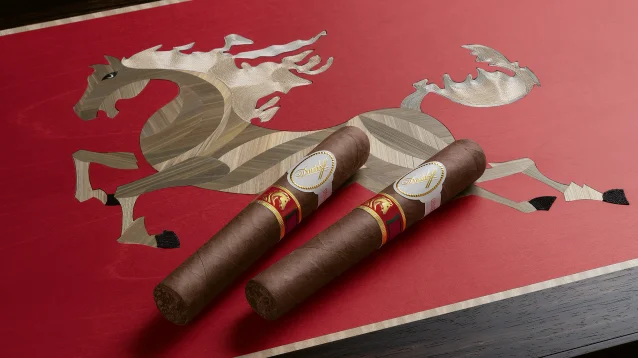 Two Davidoff Year of the Horse cigars rest on a vibrant red surface, featuring an intricate wood inlay of a galloping horse. Elegant and artistic design.