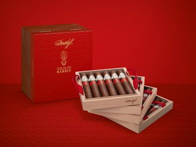 4 Trays of the Davidoff Year of the Rabbit Flagship Exclusive with cigars inside, placed next to their box.