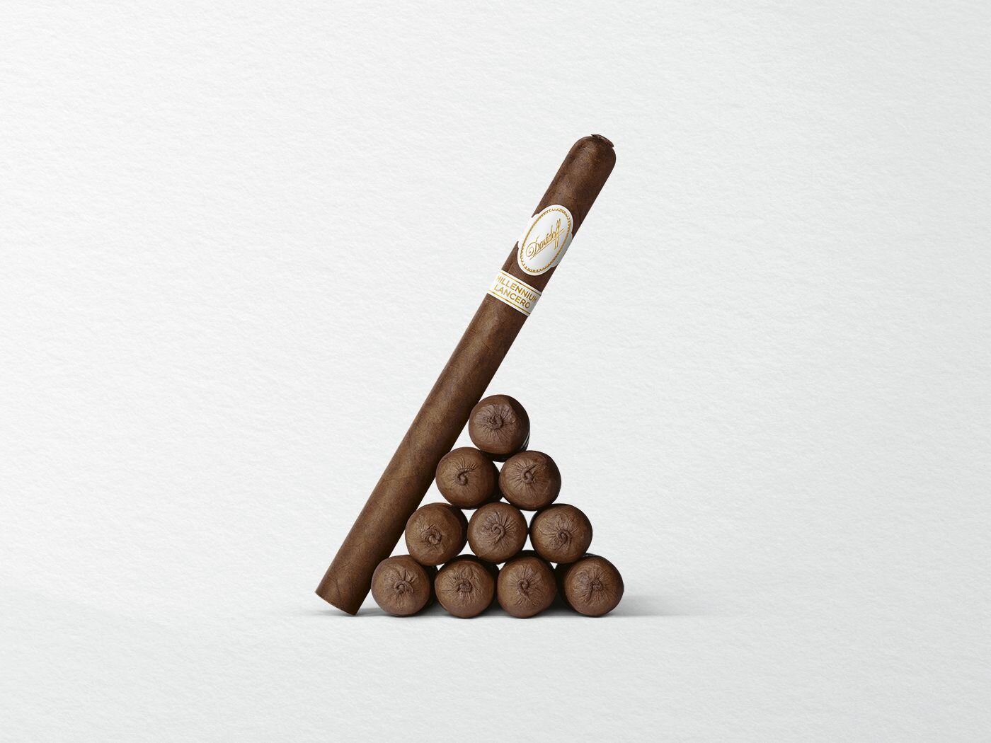 10 cigars of the Davidoff Millennium Lancero Limited Edition piled up in a triangular shape, with one cigar leaning against them.