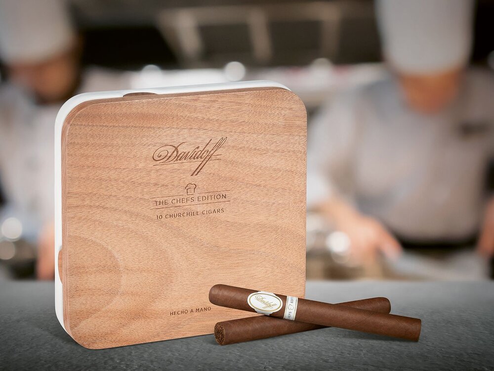 Davidoff Chef's Edition cigar box with two crossed cigars in front of it. 