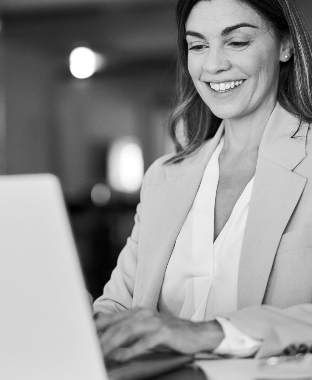 Lady on laptop smiling