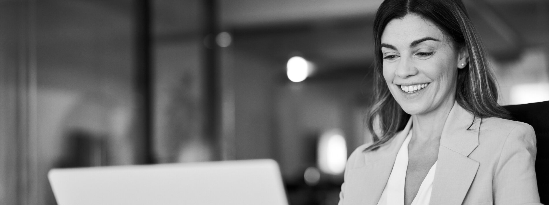Lady on laptop smiling