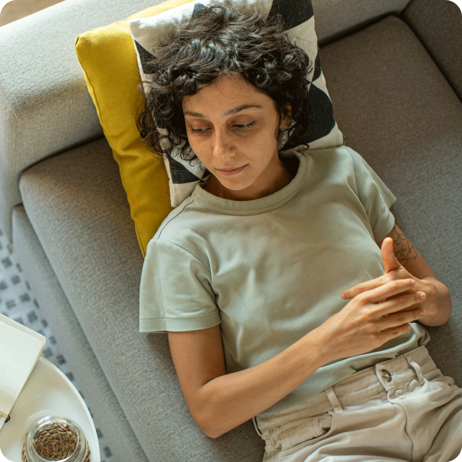 woman laying on couch during a therapy session with therapist