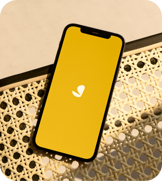 iphone with yellow screen snd simplepractice logo in cetner