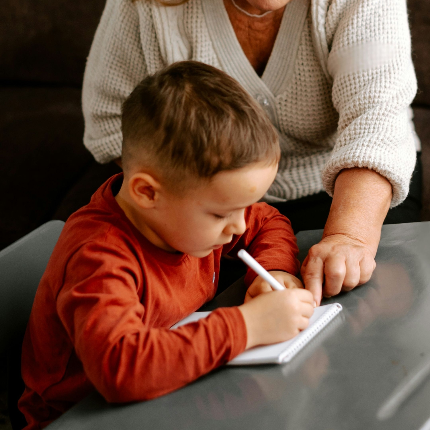 child working on emotions worksheets for preschool age clients