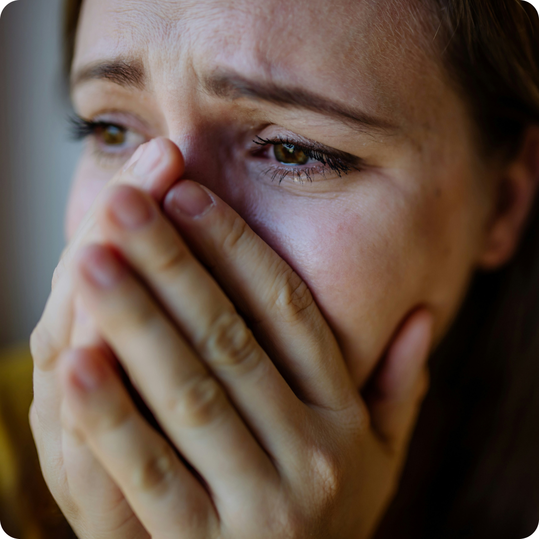 close up photo of woman looking distressed