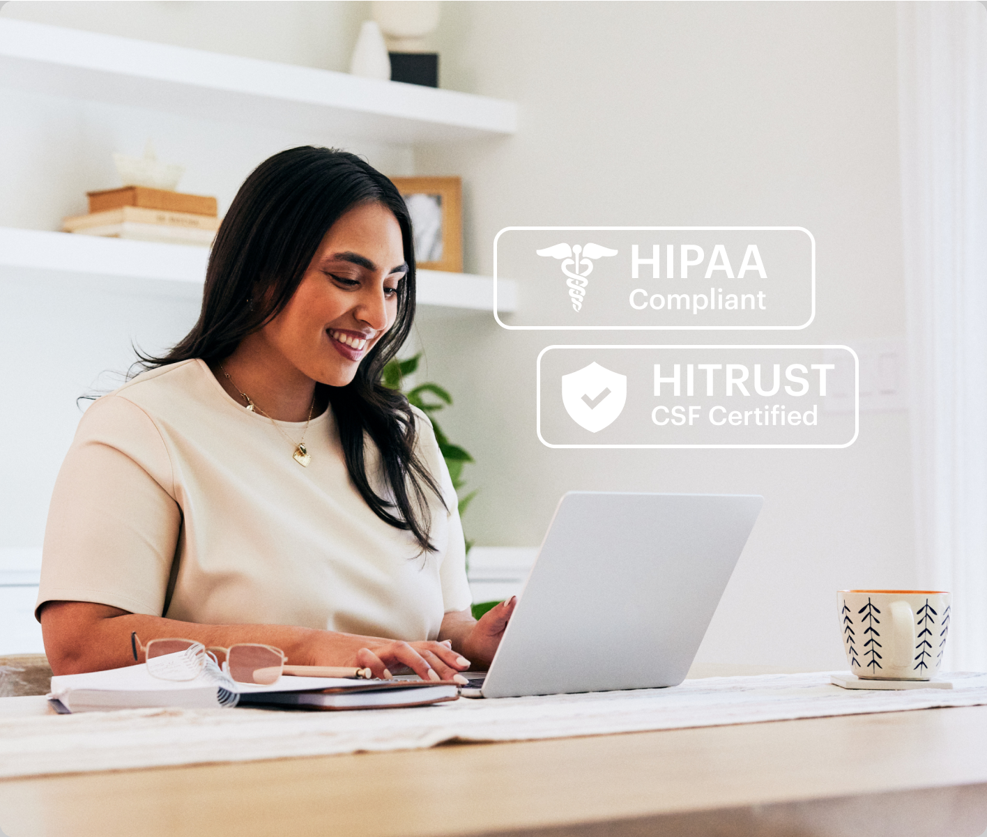 occupational therapist using a laptop, graphic showing HIPAA and HITRUST compliance