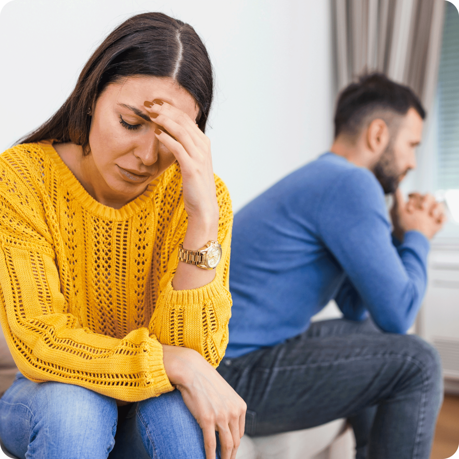 woman and man looking away from each other looking stressed