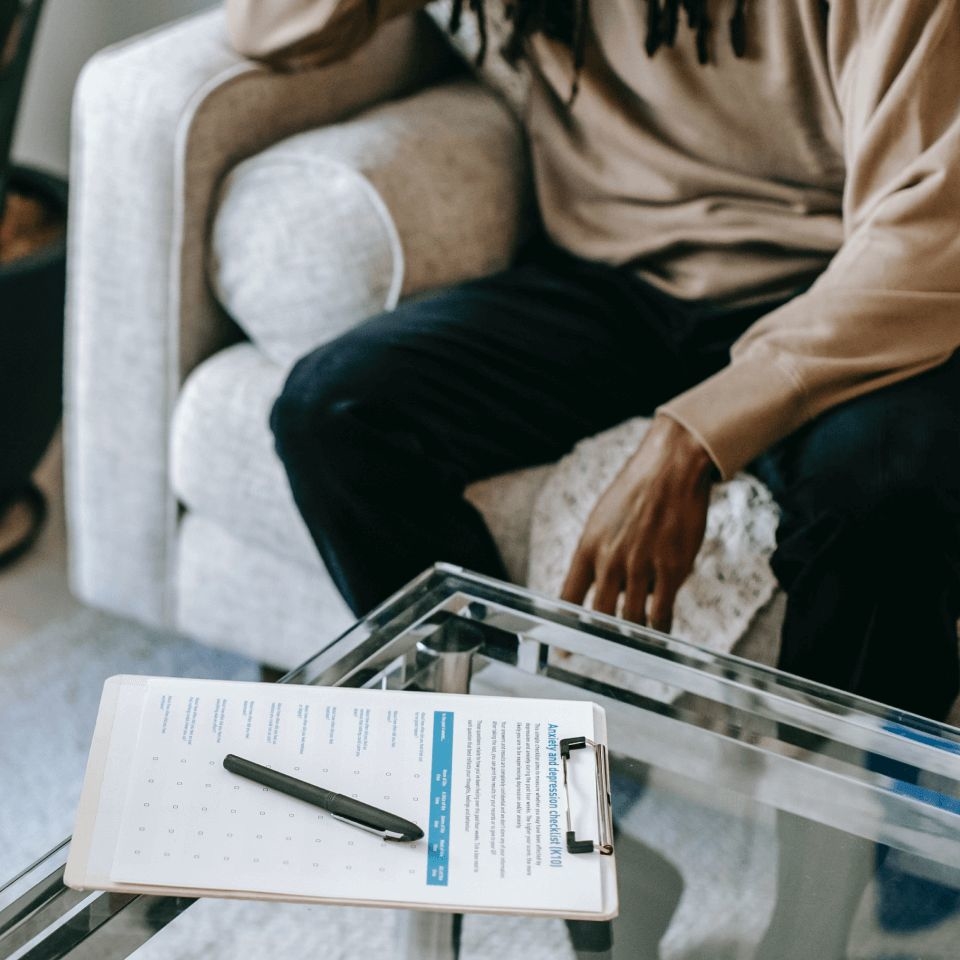 A clipboard on a table with anxiety worksheets