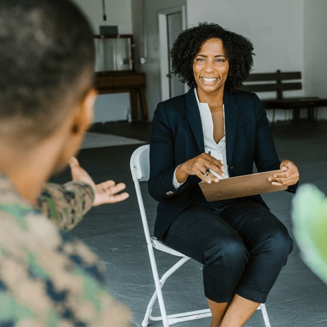 A female mental health clinician determines which PTSD ICD-10 code to use for her military service member client.