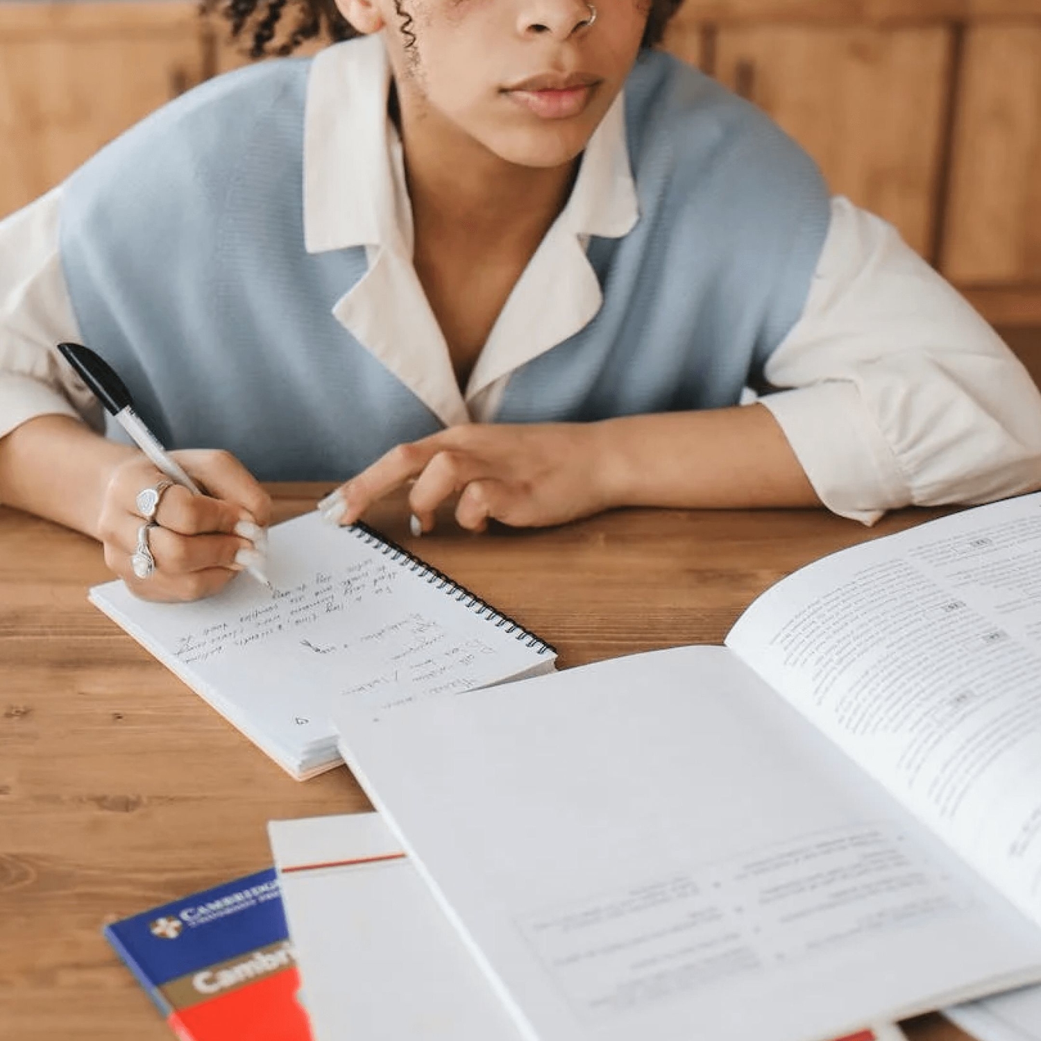 Female clinician writing down adhd f codes into notebook