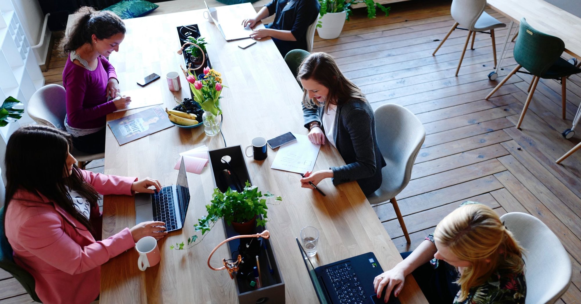 group of clinicians sitting around a table and working together