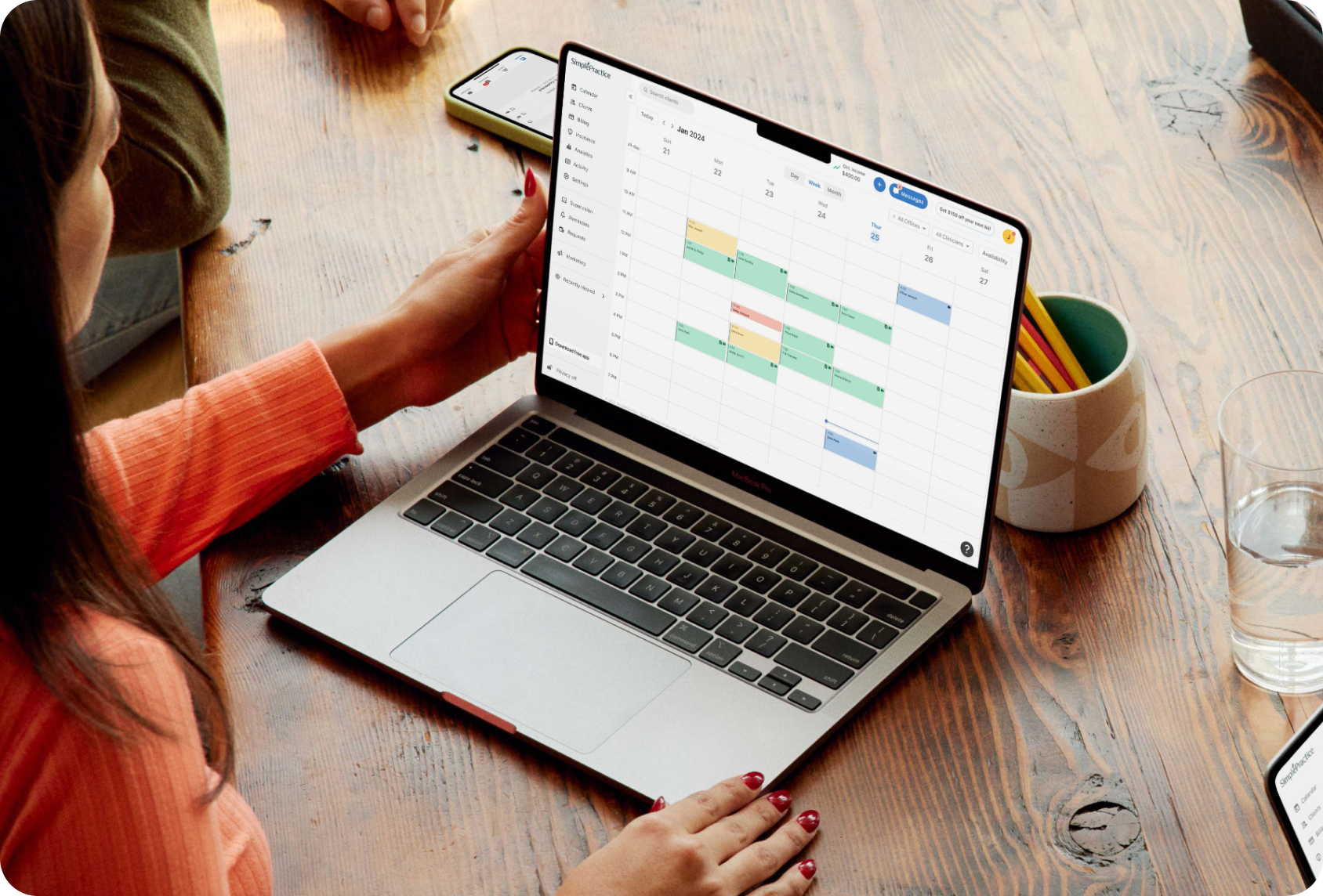 Person viewing SimplePractice schedule on laptop
