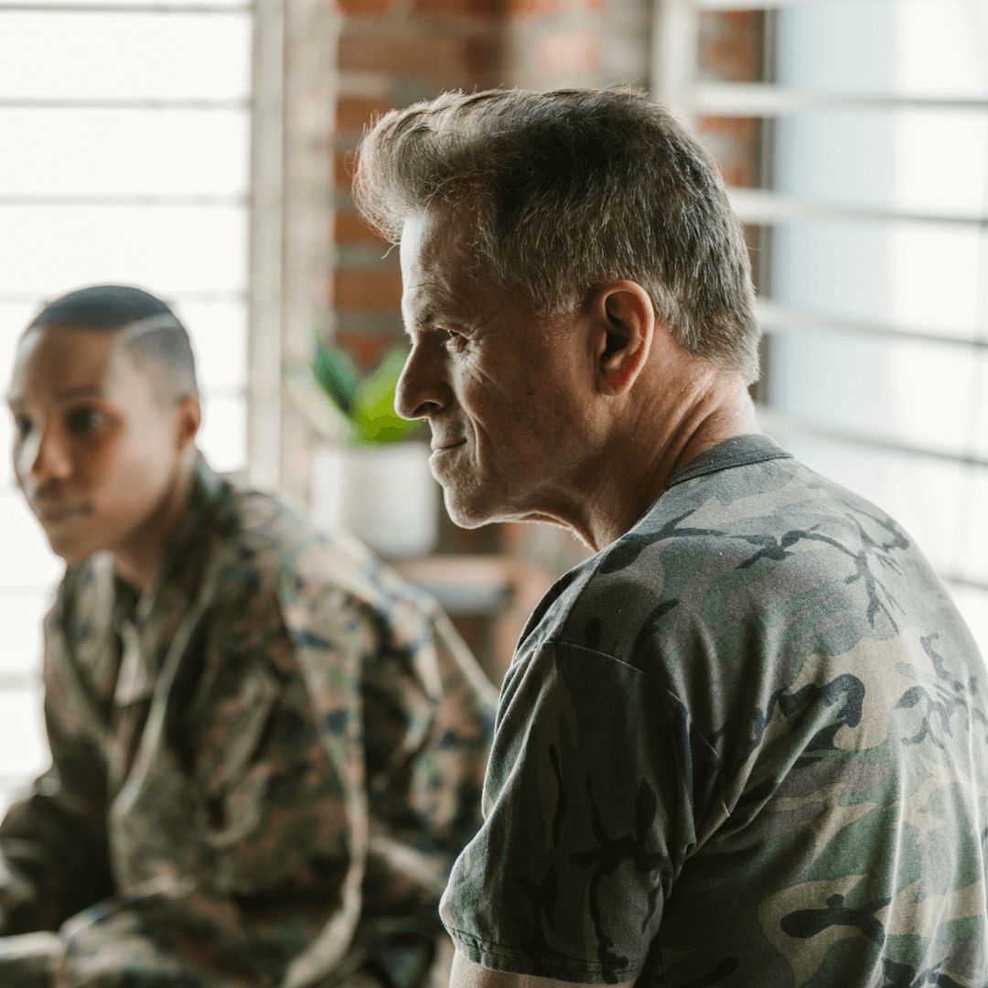 Military service members suffering from chronic PTSD sit in a group therapy session