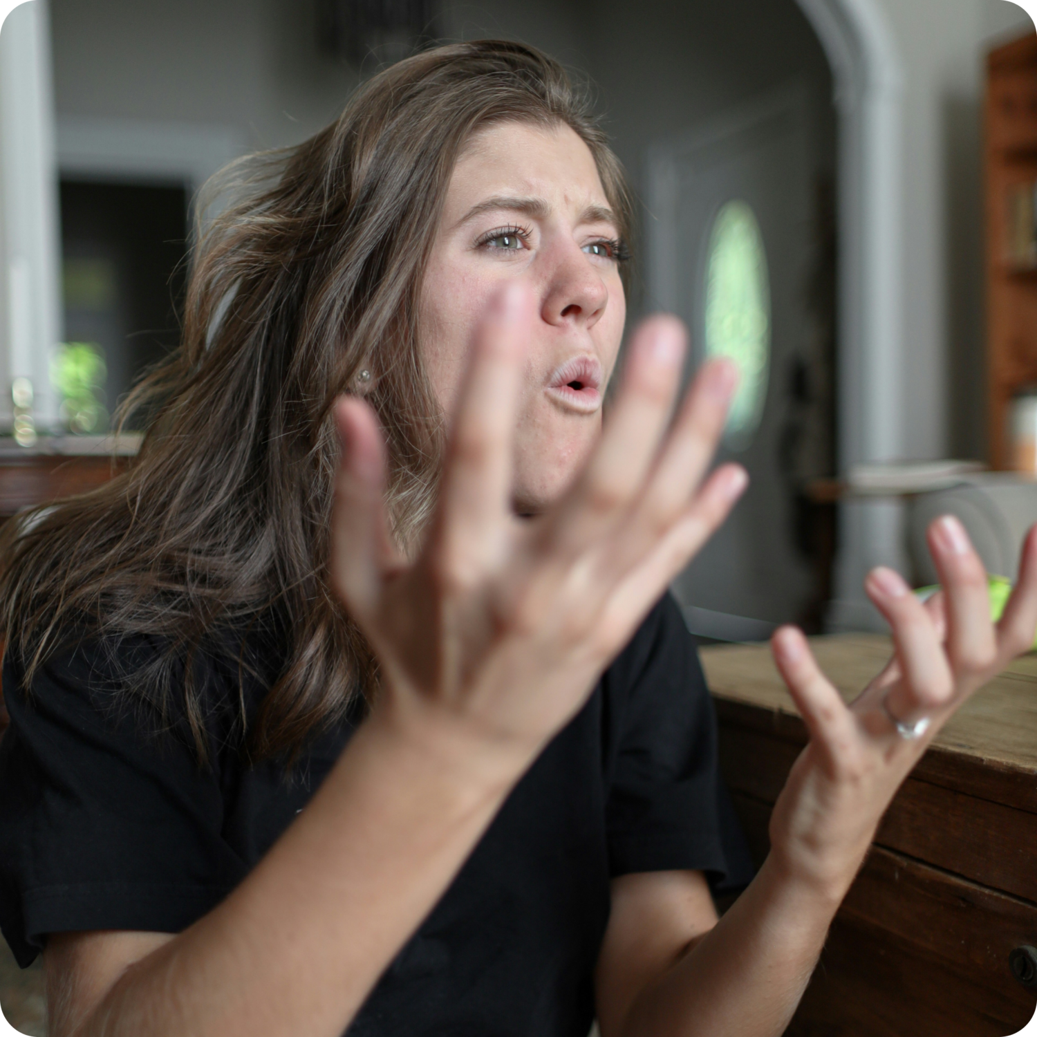 woman yelling and holding her hands in anger