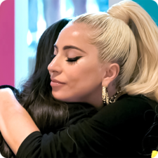 Lady Gaga hugging a young person