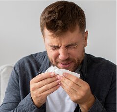 man sneezing