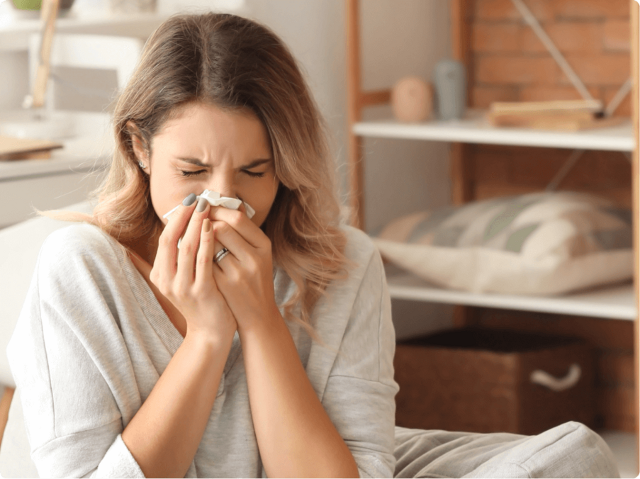 woman sneezing from allergies