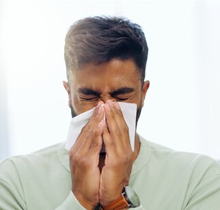 man sneezing