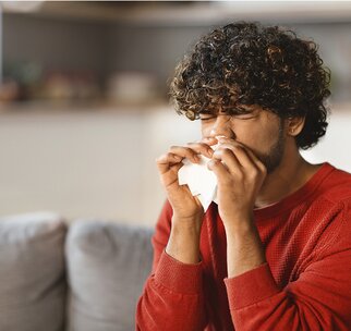 man sneezing