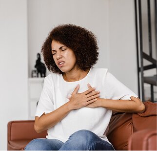 woman grasping heart region