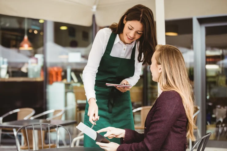 Blonde woman at restaurant asking server if there's seed oil in the meal she's ordering.