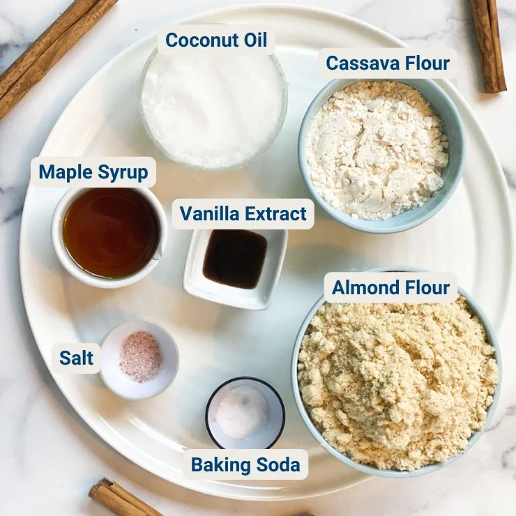 Top view of sweet potato tart crust ingredients in bowls with their names labeled next to them