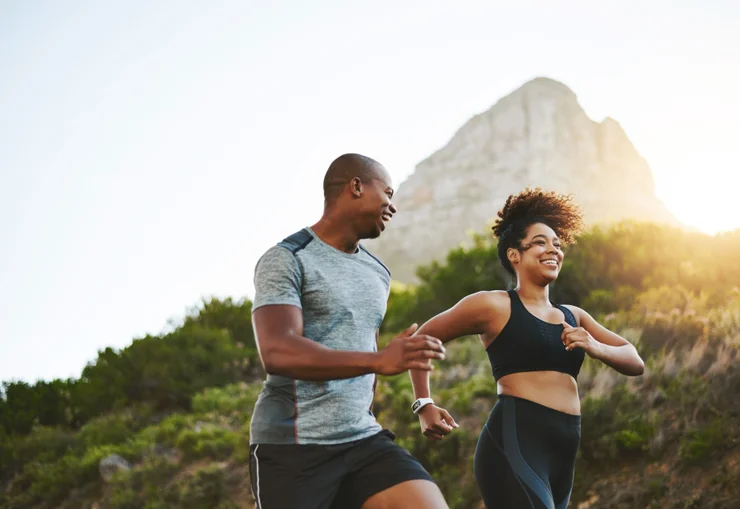 A man and a woman going on a walk to workout