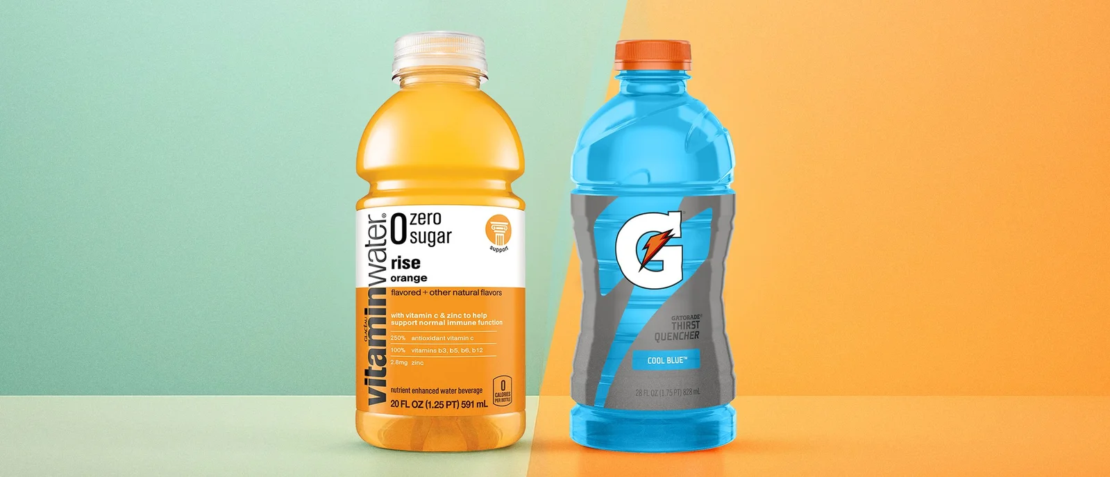 A bottle of orange Vitamin Water next to a bottle of blue Gatorade