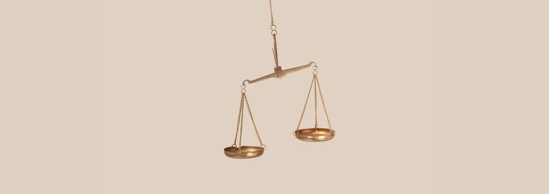 A balance scale tipped to one side