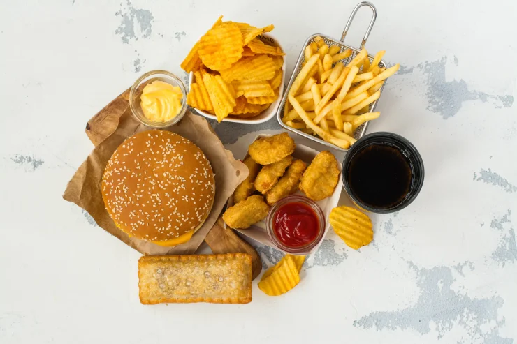 Junk food on table. Fast carbohydrates not good for health, heart, and skin.