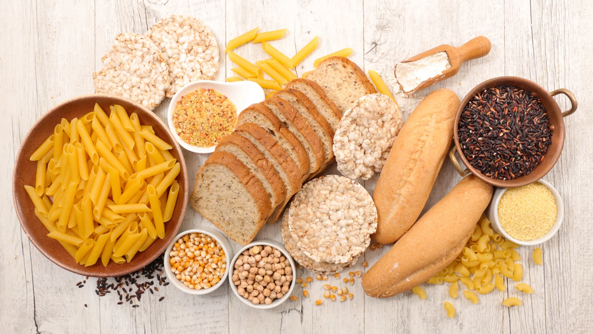 Variety of foods with gluten: Bread, pasta, flour.
